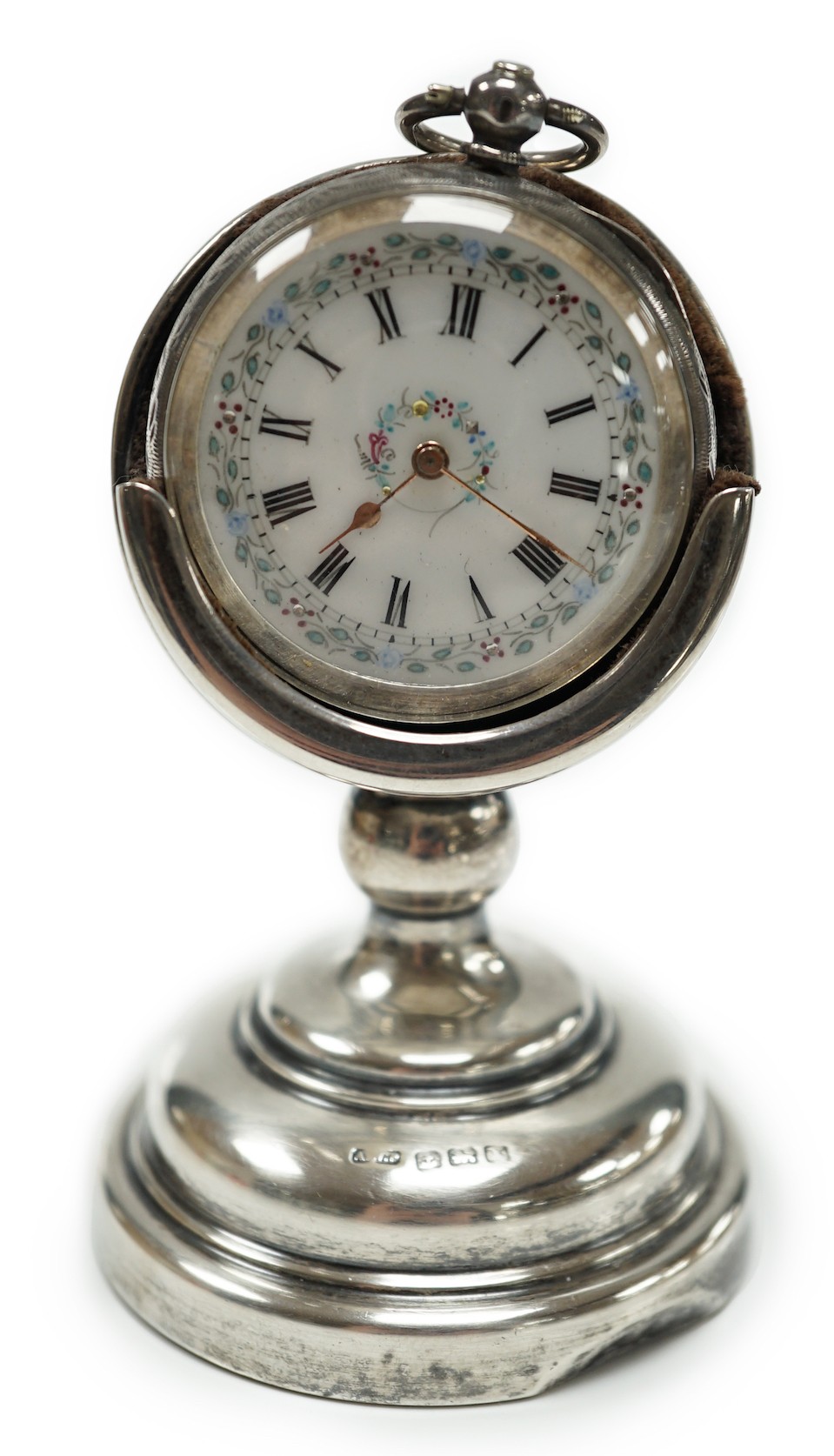 A George V silver mounted fob watch stand, Birmingham, 1923, 79mm, containing a Swiss white metal fob watch.